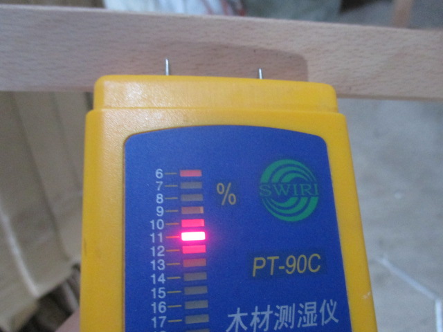 Inspector performing moisture check during furniture inspection